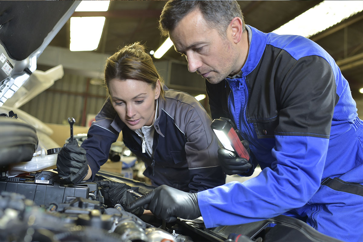 Mechanic giving on the job training